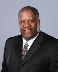 John Smith Chairman man in suit